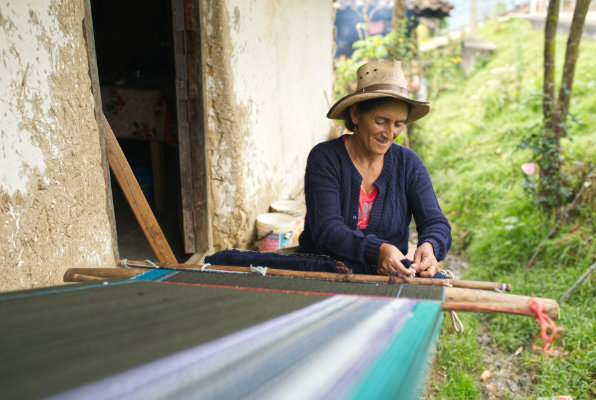 Weaver with backstrap loom